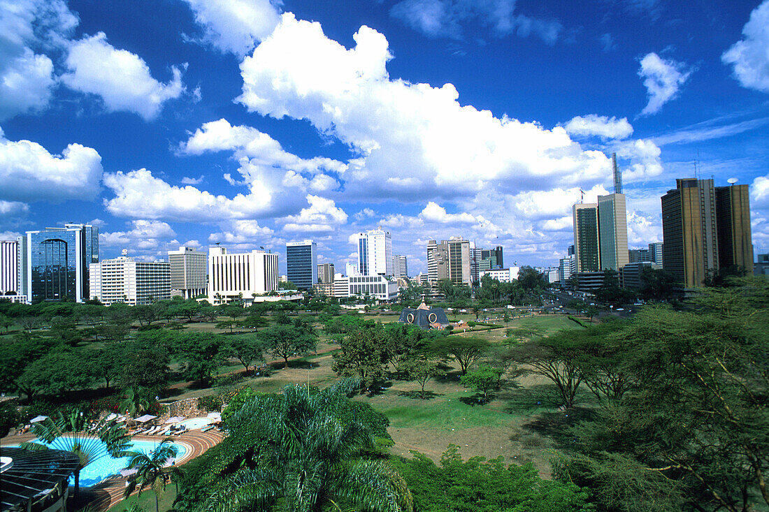 View from the pool of the Serena luxury hotel at a park and high rise buildings, Nairobi, Kenia, Africa