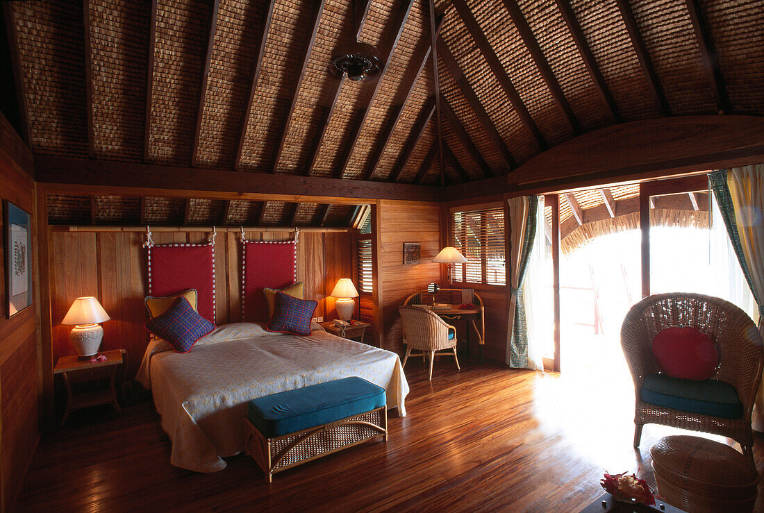Interior view of a water bungalow, Bora Bora, French Polynesia, South Pacific