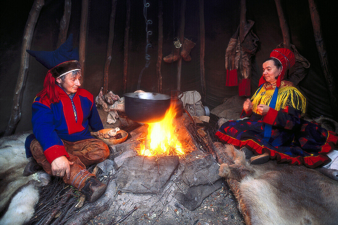 Lapps wearing traditional costumes at a bonfire, Mageroeya, Finnmark, Norway, Europe