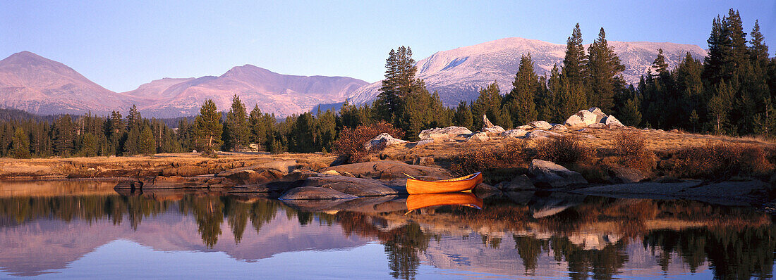 A canoe lying at the river bank, Yosemite National Park, California, USA