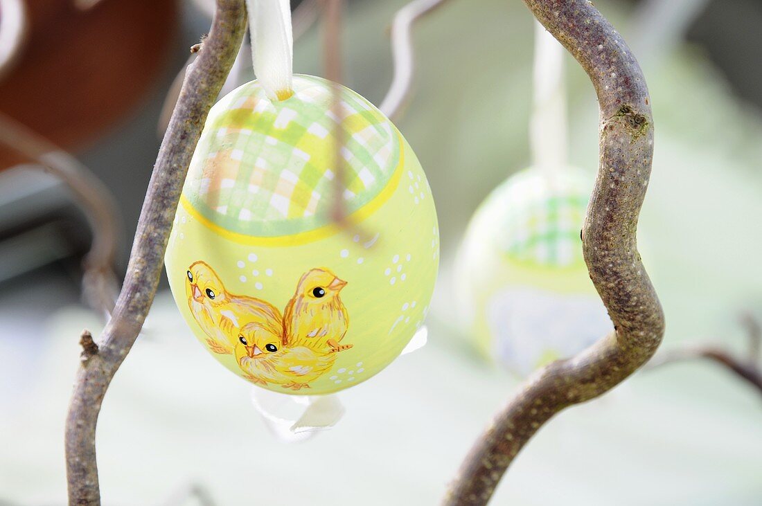 A painted Easter egg on a twig