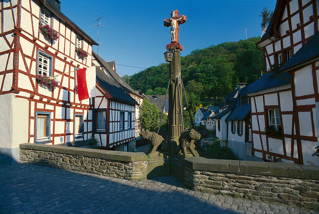 Elzbach bridge and half timbered houses in Monreal, Eifel, North Rhine-Westphalia, Germany