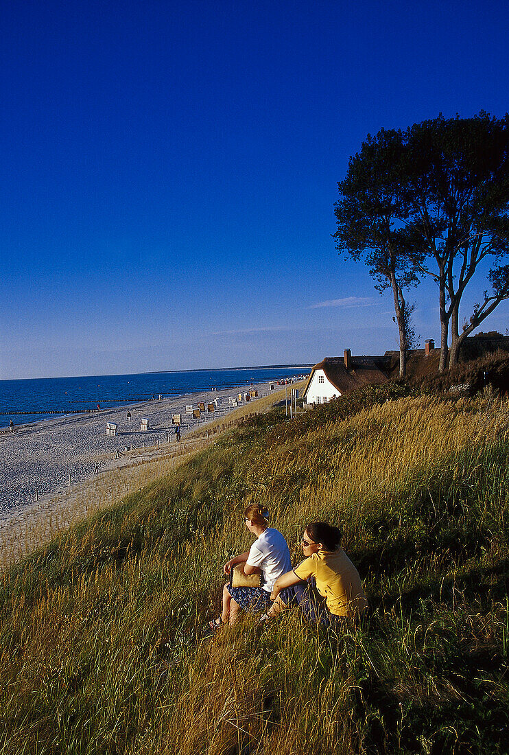 Two women admiring the view, Beach near Ahrenshoop, Fischland Darss Zingst, Mecklenburg- Vorpommern, Germany
