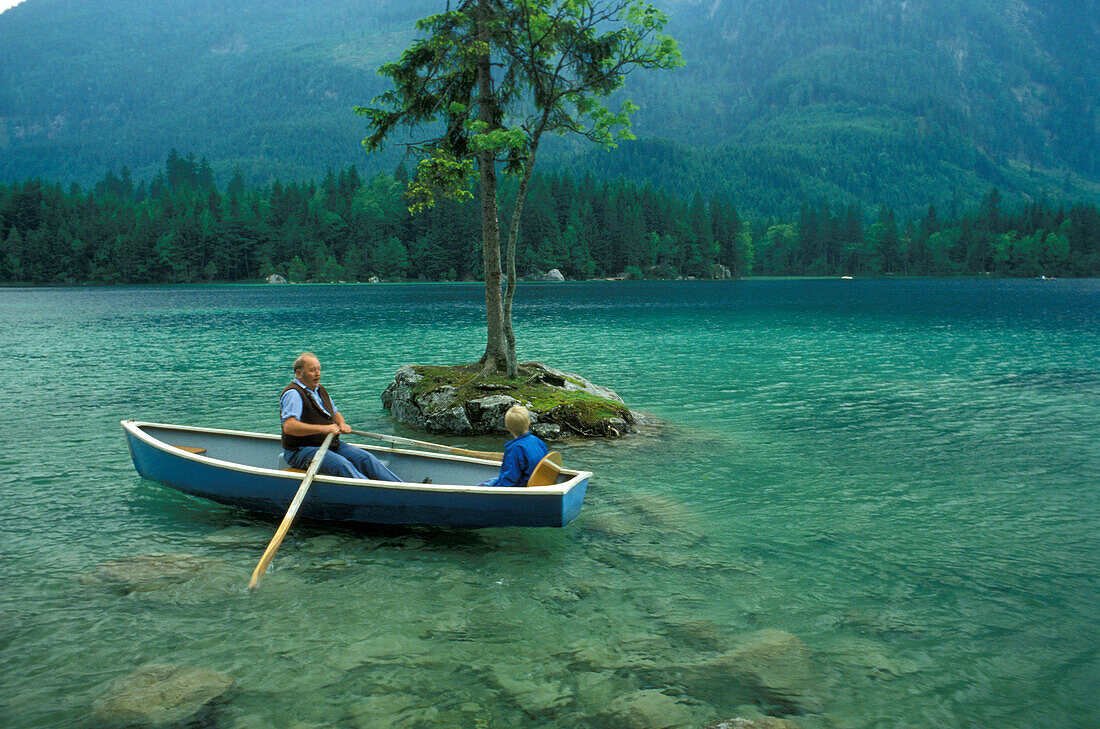Man and boy in a rowing boat, Ramsau, Upper Bavaria, Bavaria, Germany