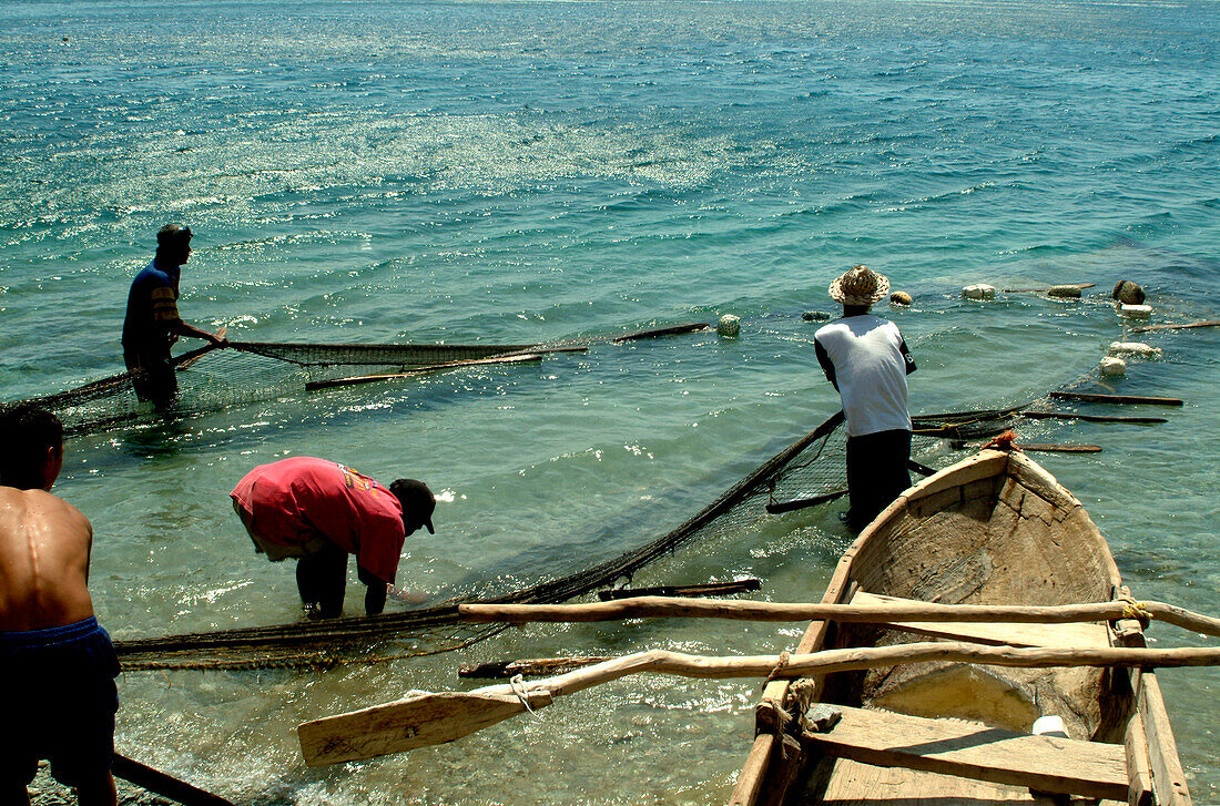 Fishermen with net and boat, Taganga, Santa Marta, Colombia, South America