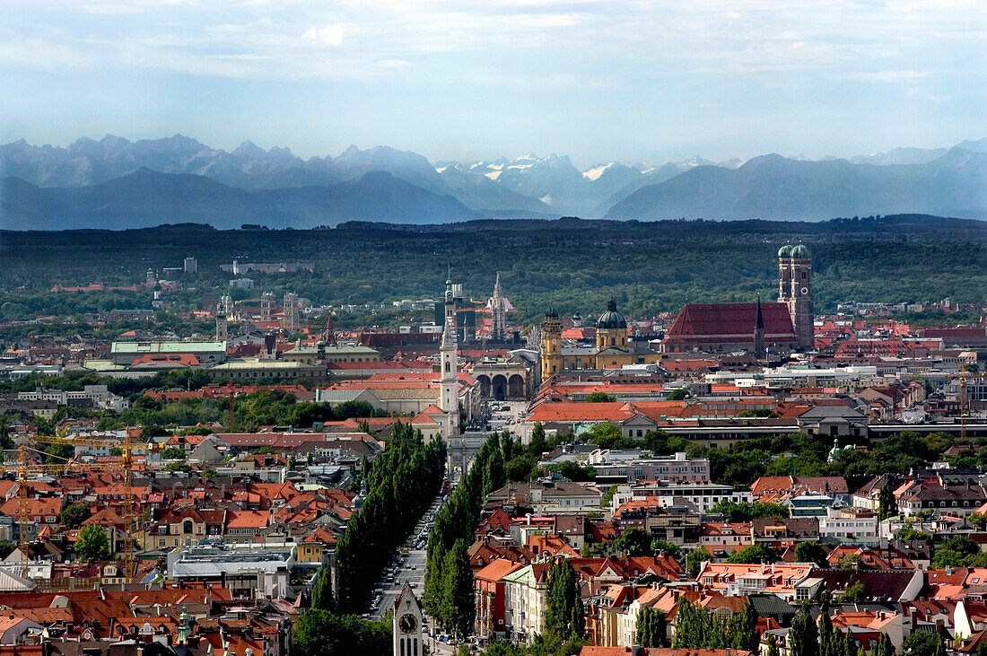 Skyline of Munich with Frauenkirche, Leopoldstrasse and Alps, Bavaria, Germany