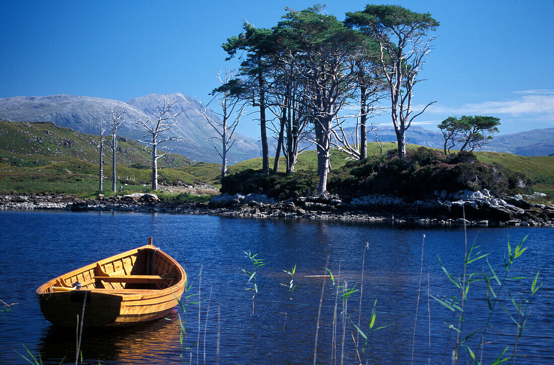 Boat on lake Loch Assynt, Sutherland, Highlands, Scotland, Great Britain, Europe