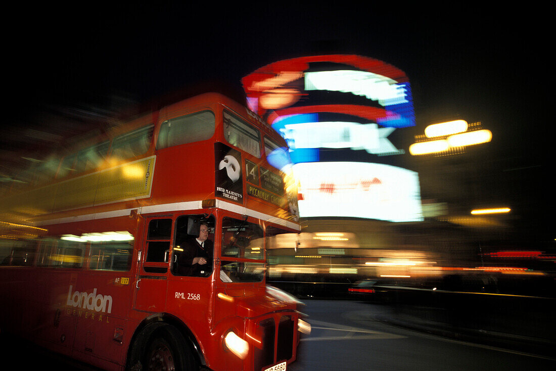 Double decker bus in the street at night, Piccadilly Circus, London, England, Great Britain, Europe