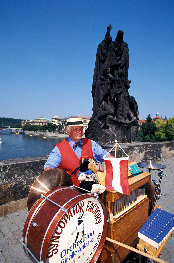 Musician at Charles Bridge in the sunlight, Prague, Czechia, Europe
