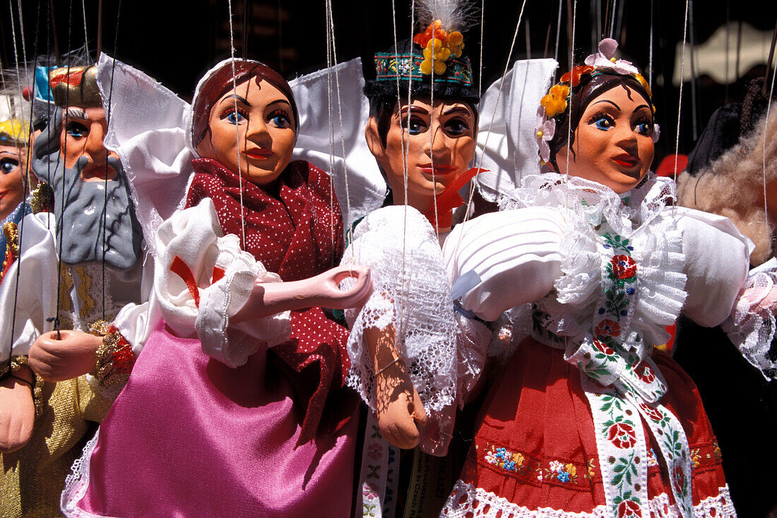 Puppets in traditional costumes at Havelske Street Market, Prague, Czechia, Europe