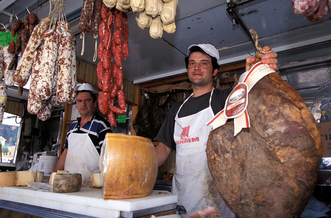 Salesmen at a market stand, Porto Azzurro, Isle of Elba, Tuscany, Italy, Europe