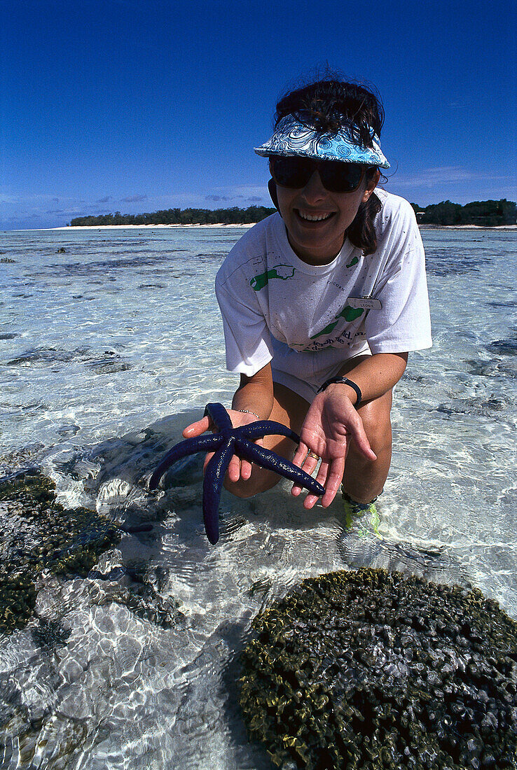 Woman with Blue Starfish, Heron Island, Queensland, Australia