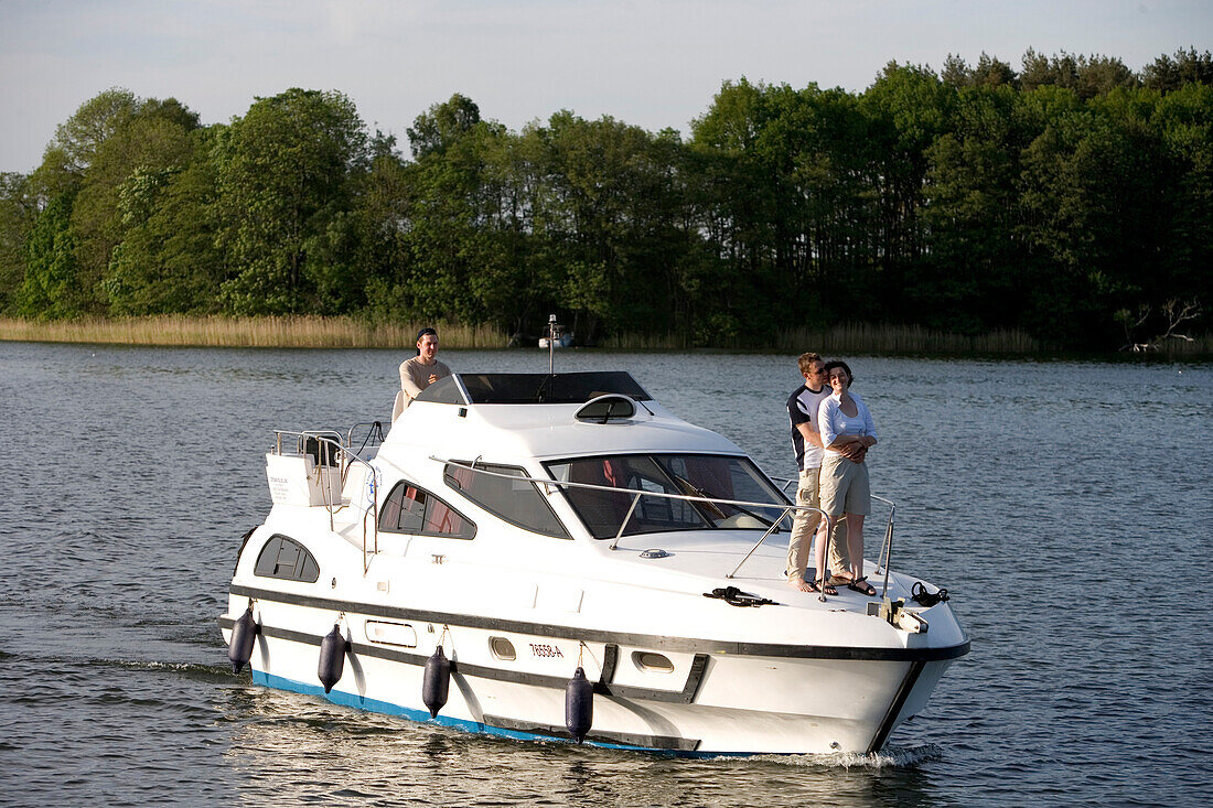 Couple on Houseboat, Couple on houseboat, Crown Blue Line Consul Houseboat, Lake Ellbogensee, Mecklenburgian Lake District, Germany