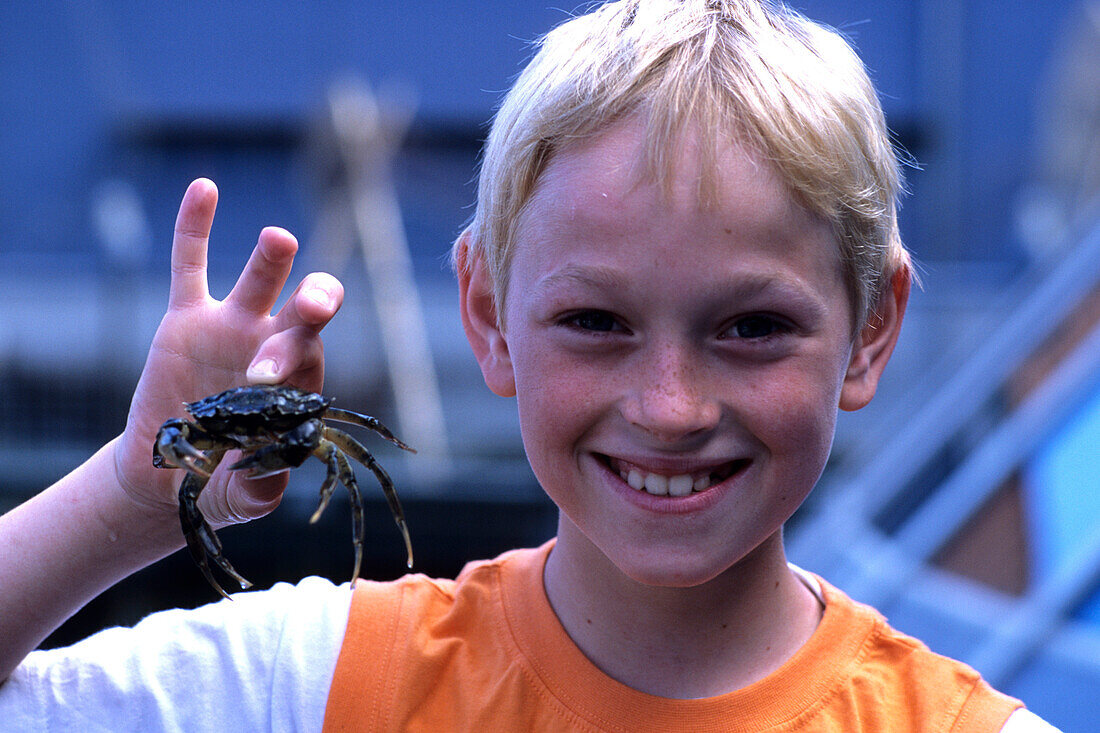 Boy Holding Crab, Fjord & Bælt Center, Kerteminde, Funen, Denmark