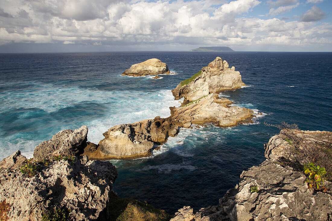 String of steep rocks at Pointe des Chateaux stretches out into the Atlantic, Grande Terre, Guadeloupe