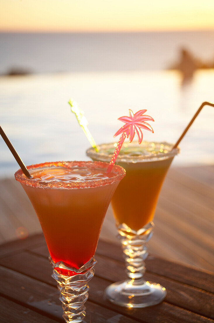 Colourful cocktails at the pool of Hotel Restaurant Le Rayon Vert in the evening, Deshaies, Basse-Terre, Guadeloupe, Caribbean Sea, America
