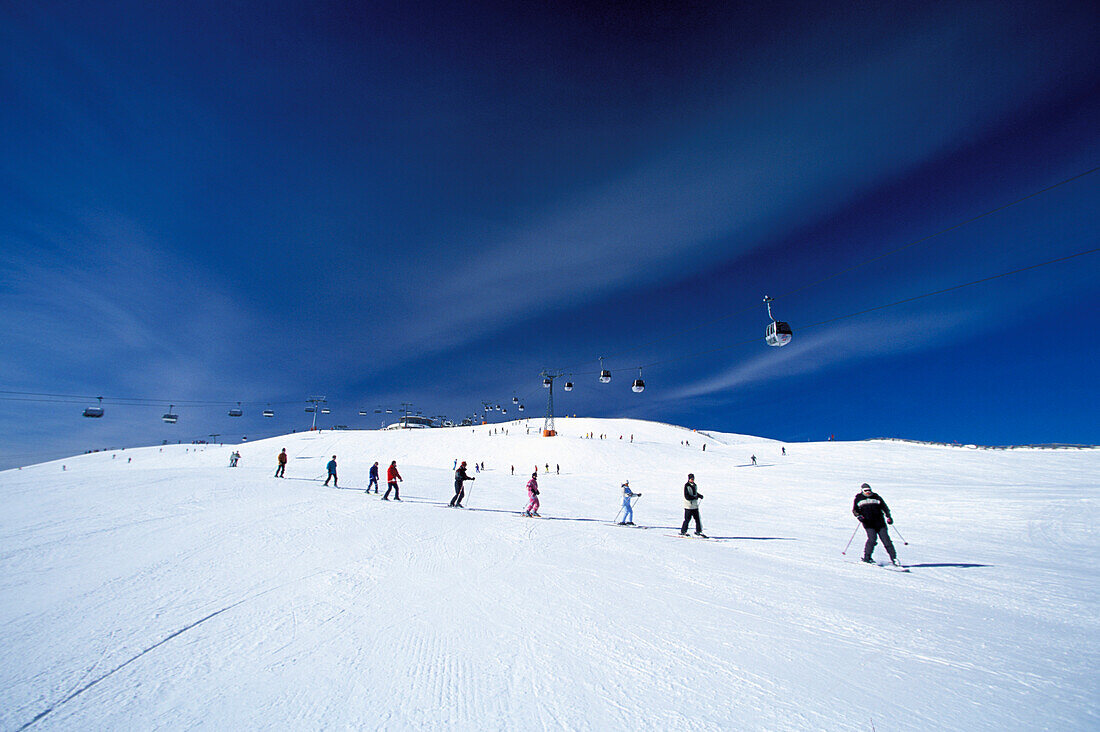 Skiers going downhill, Ski Resort Kronplatz, Plan de Corones, Dolomites, South Tyrol, Italy, Europe