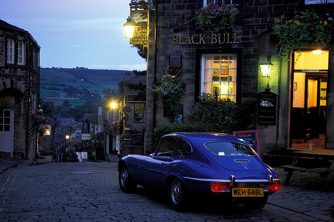 Jaguar E-Type in front of a pub in the evening, Haworth, Yorkshire, England, Great Britain, Europe