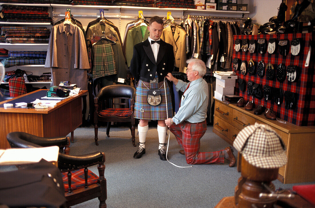 Kiltmaker Ian Chisholm taking measurements, Inverness, Scotland, Great Britain, Europe