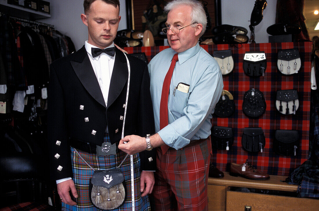 Kiltmaker Ian Chisholm taking measurements, Inverness, Scotland, Great Britain, Europe