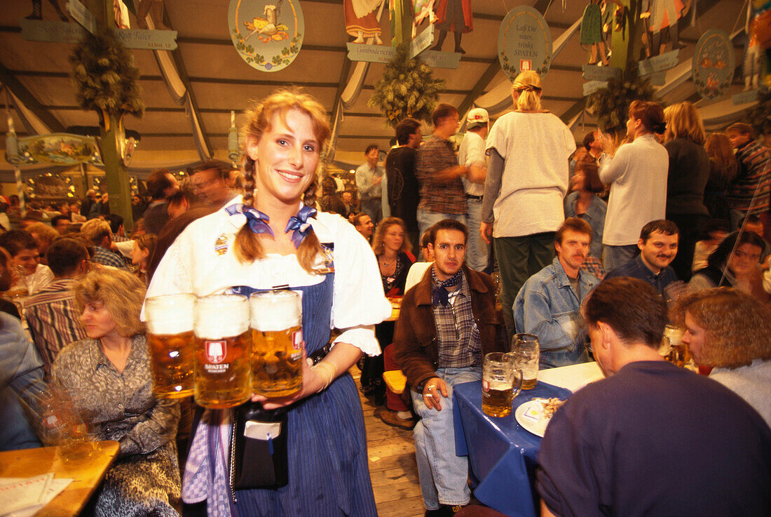 Waitress Barbara serving beer in the tent, Munich Oktoberfest, Bavaria, Germany
