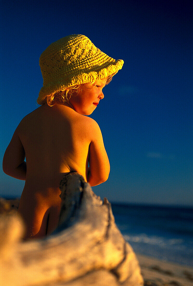 Girl on the beach, sunset, Anse Kerlan, Praslin, Seychelles