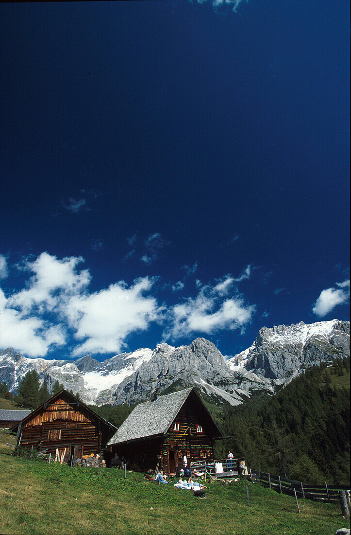 Alpine huts with mountain landscape, Schlitzenalm, Dachstein mountains, Salzburg, Austria