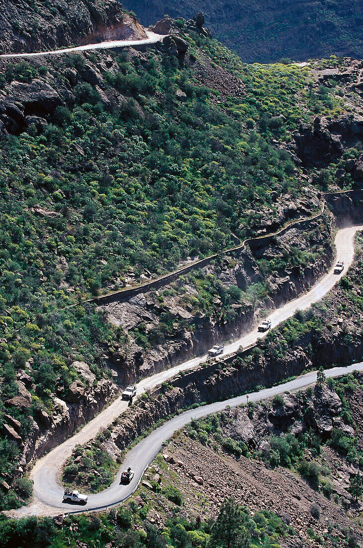 Jeeps on a serpentine, Barranco, de Mogan, Gran Canaria, Canary Islands, Spain