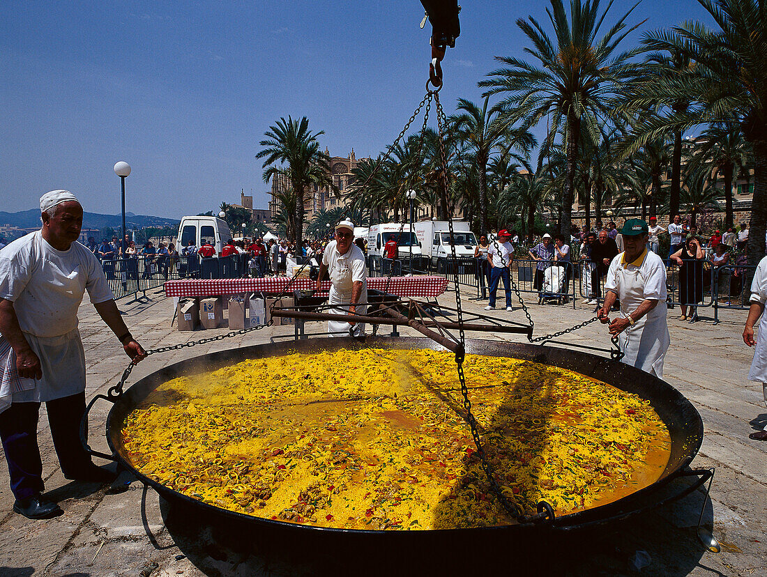 A huge pan of paella at a festival, Cathedral in the background, Parc de la Mar, Palma de Majorca, Majorca, Spain