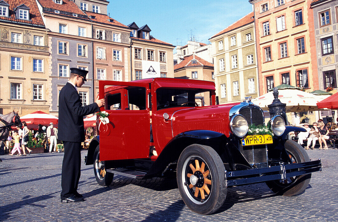 Red oltimer at old market square, Warsaw, Poland, Europe