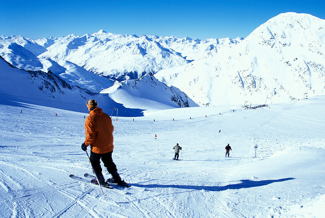 People skiing on the slopes, Stubaital Glacier, Tyrol, Austria