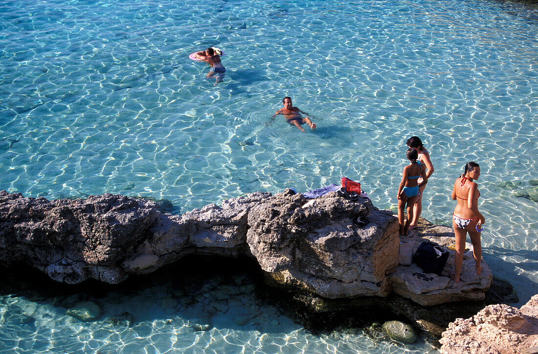 People bathing in the Blue Lagoon, Comino Island, Malta, Europe