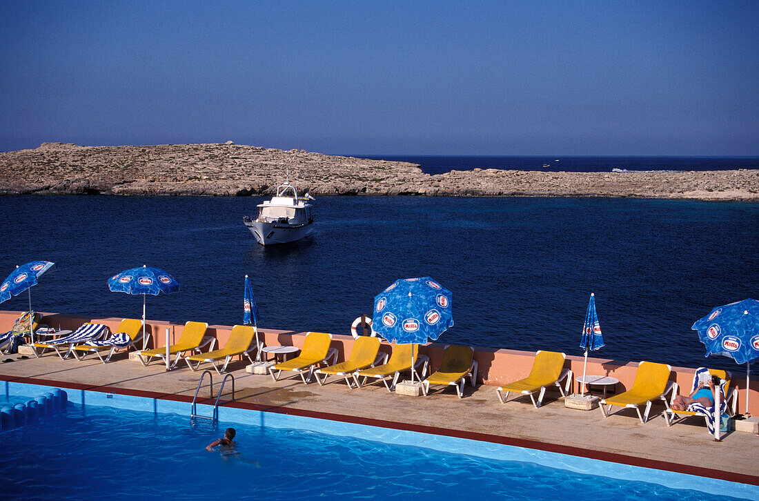 People at the pool of Comino Hotel, Comino Island, Malta, Europe