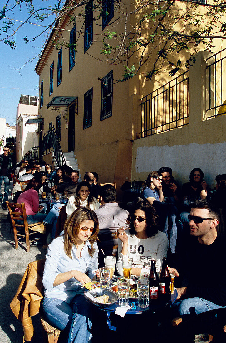 People in Cafe Dioskouri in the evening, Greek Agora, Plaka, Athens, Greece