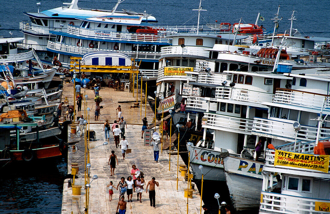 Loading Amazon river boats in the floating harbour, of Manaus, Amazonia, Brazil