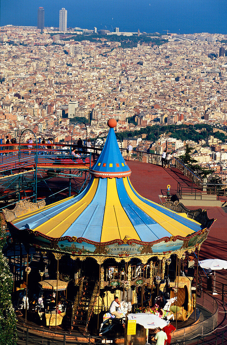 Merry Go Round Barcelona, View to Barcelona to overlooking Observatori Fabri, Tibidabo funfare ferries wheel, Barcelona, Spain