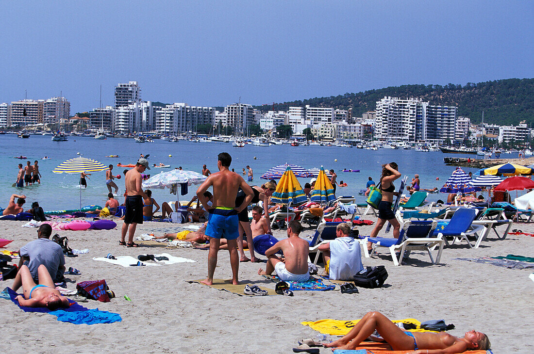 People on the beach at Sant Antoni, Beach life, Ibiza, Balearic Islands, Spain