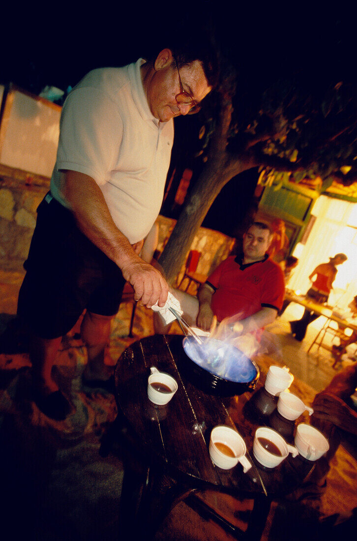 Man Gremat Drink Costa Brava, Cremat Drink at Cantada d«Havaneras, Calella de Palafrugell, Costa Brava, Catalonia, Spain