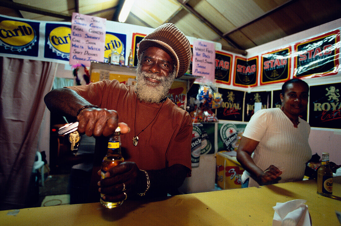 Man selling beer in roadside shop, Carnival, Port of Spain Trinidad
