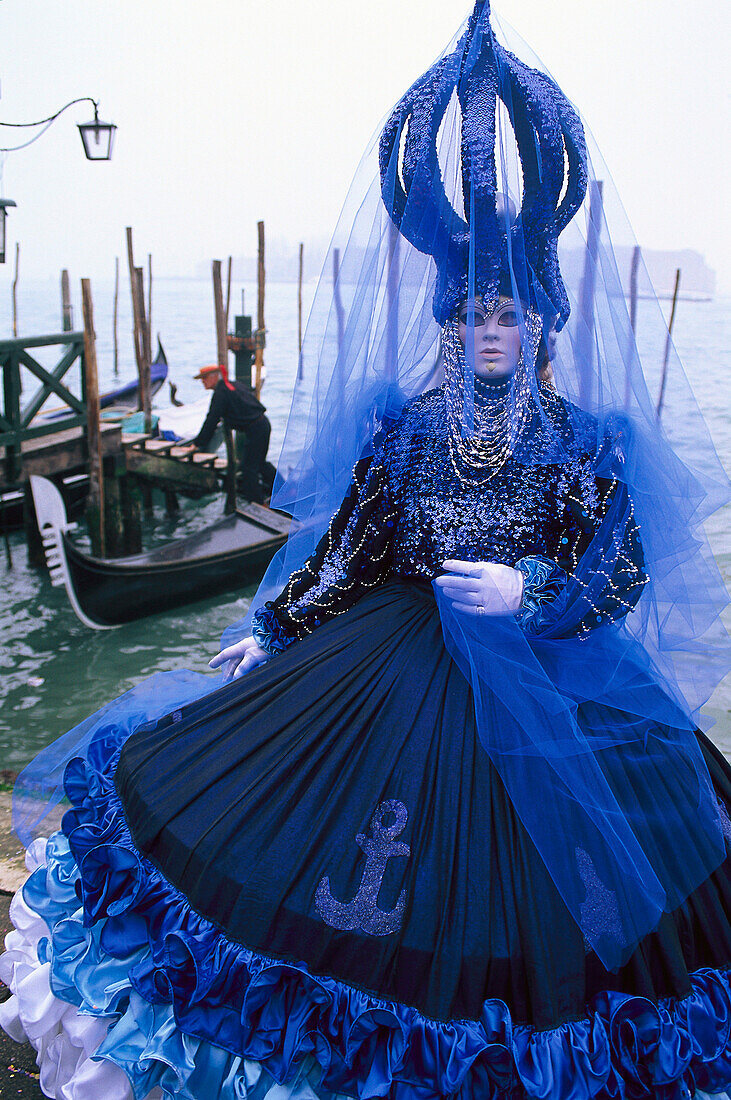 Disguised person with mask on the waterfront, Venice, Veneto, Italy, Europe