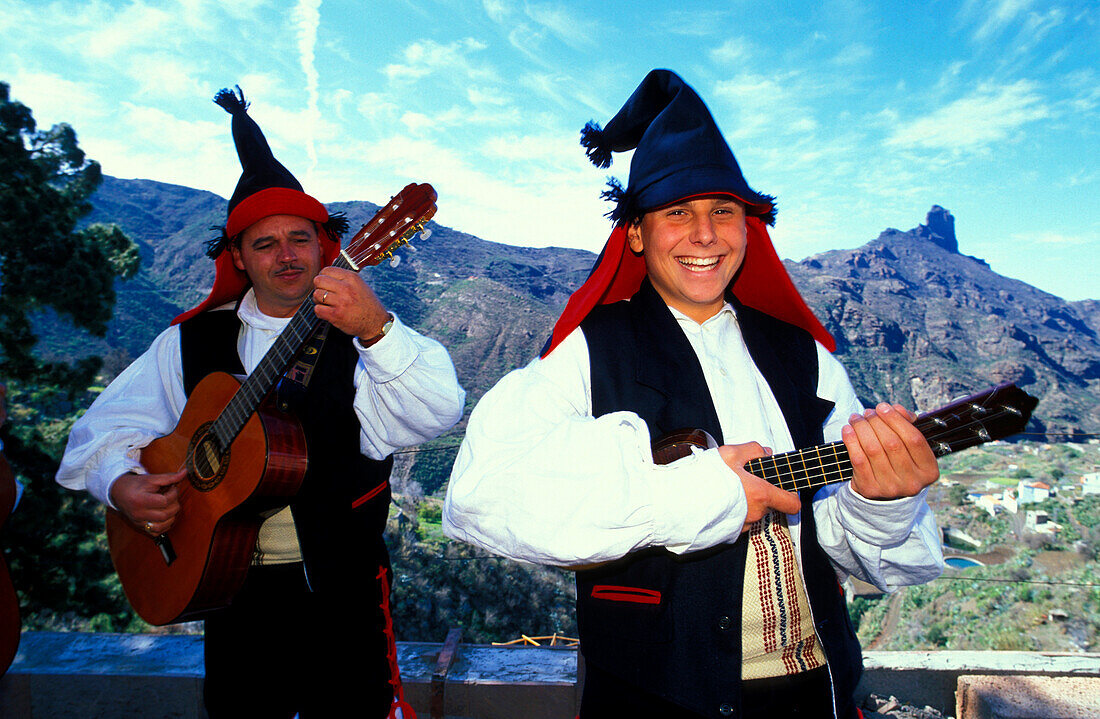 Two musicians in traditional clothes laughing, Folklore music, Celebration of the almond flower, Canary Islands, Spain