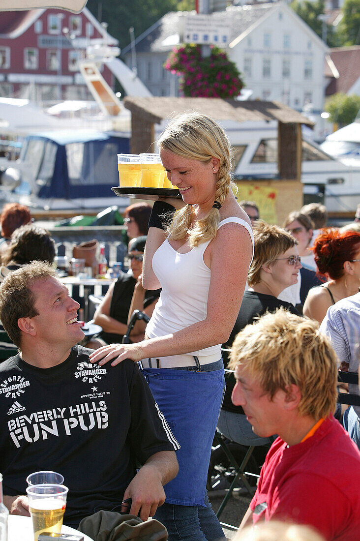 Waitress with tablet of beer, Skagen, Stavanger, Rogaland, Norway
