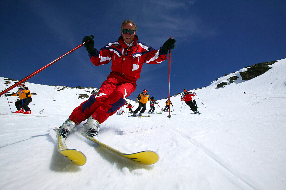 Group of skiers on the slope, Skiing downhill, Sulden, Italy