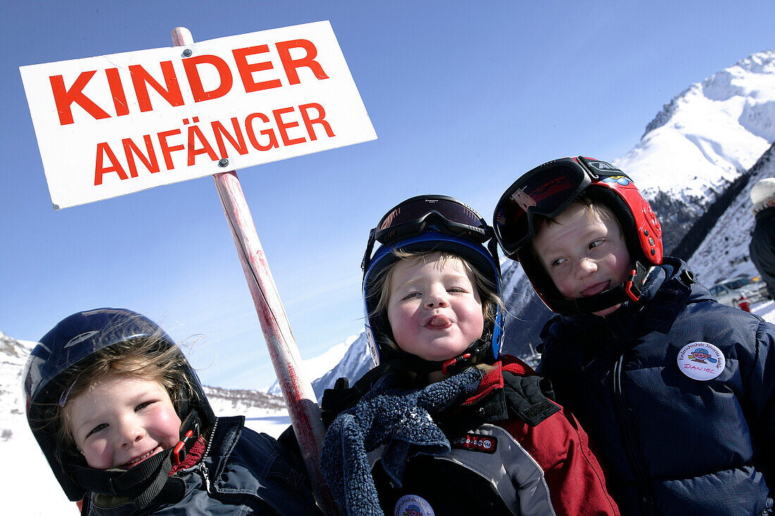 Skiing Galtueer, Austria, Three kids with sign, Beginner, Wirl near Galtuer, Tyrol, Austria