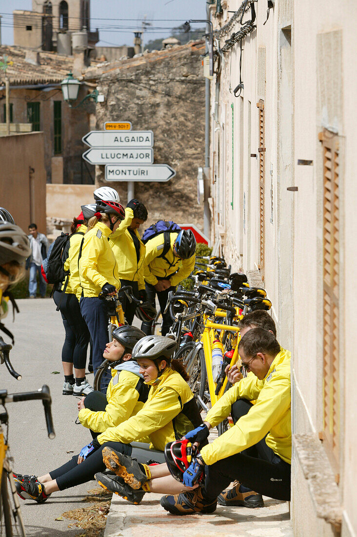 Group of cyclists taking a rest, Randa, Majorca, Balearic Islands, Spain