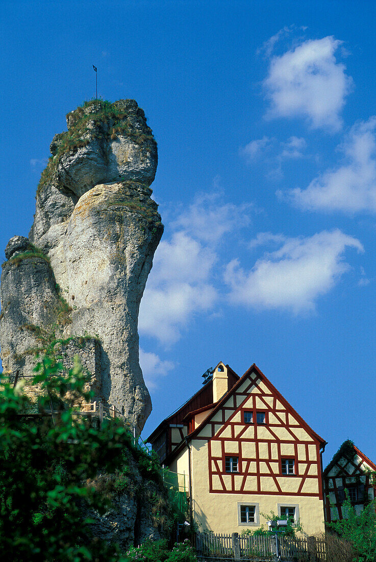 Half-timbered house next to a rock, Tuchersfeld, Franconian Switzerland, Bavaria, Germany