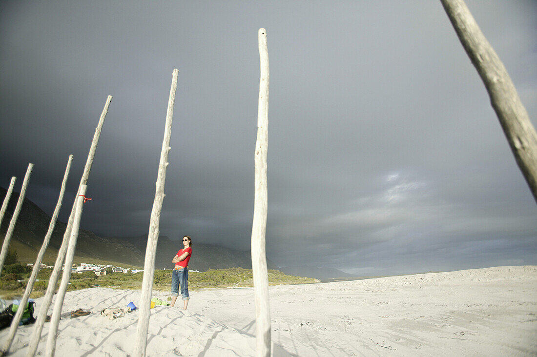 Woman standing on Grotto Beach, Hermanus, Western Cape, South Africa