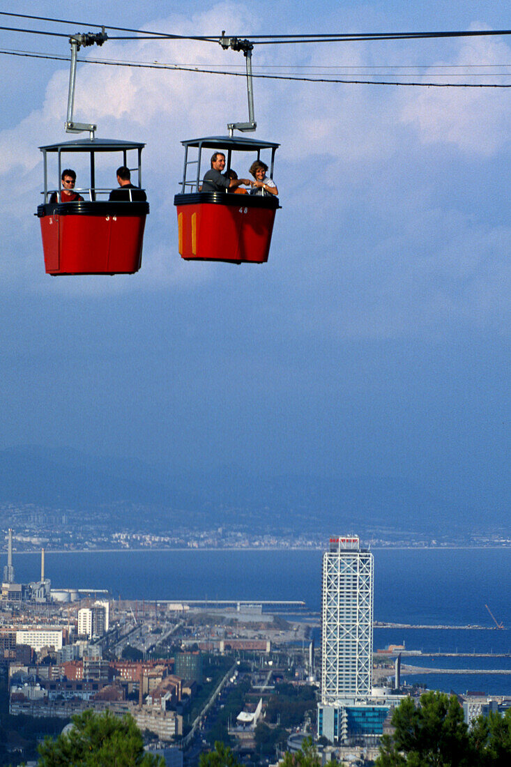 People in a cable car above the city, Montjuic, Barcelona, Spain, Europe