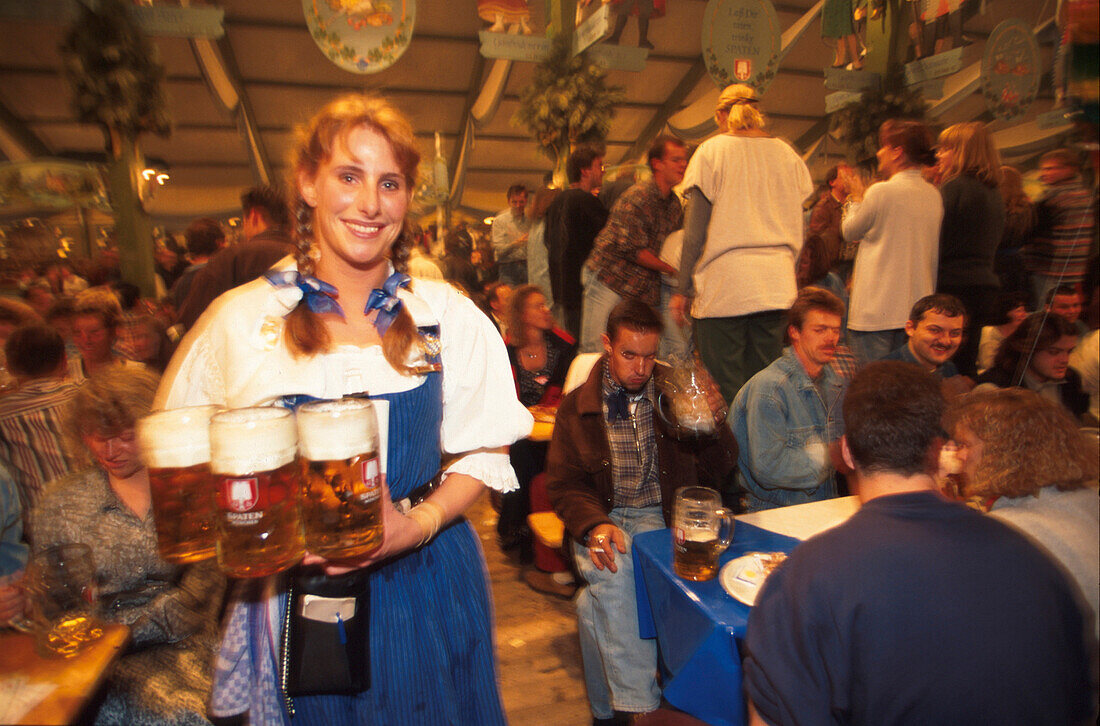 Waitress Barbara serving beer in the tent, Munich, Oktoberfest, Bavaria, Germany
