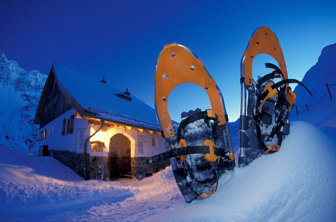 Snowshoes in front of skihut, Potsdamer Huette, Stubai Alps, Austria